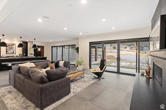 1316 N Gold Mountain Cir, Heber City, UT 84032 - living room with recessed lighting, french doors, and a fireplace