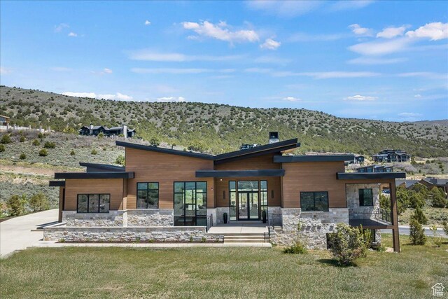 1316 N Gold Mountain Cir, Heber City, UT 84032 - rear view of property featuring stone siding, a mountain view, and driveway