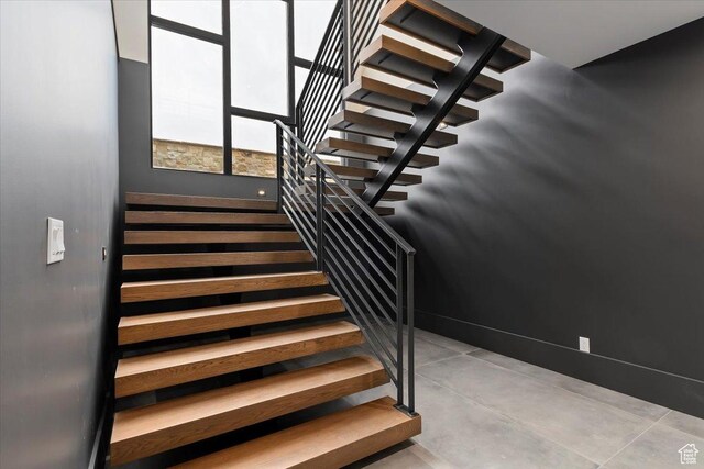 1316 N Gold Mountain Cir, Heber City, UT 84032 - staircase with baseboards and concrete flooring