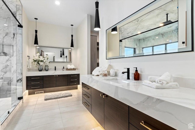 1316 N Gold Mountain Cir, Heber City, UT 84032 - bathroom featuring a marble finish shower, two vanities, and tile patterned floors