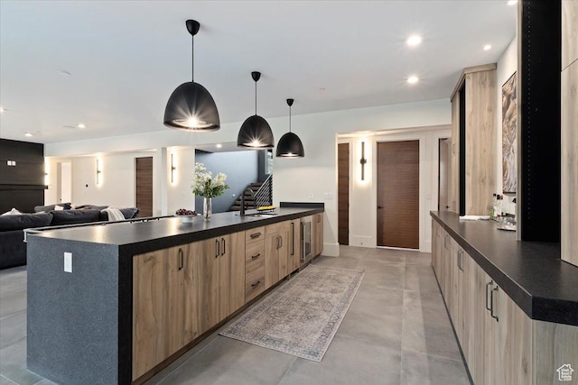 1316 N Gold Mountain Cir, Heber City, UT 84032 - kitchen featuring light brown cabinetry, dark countertops, modern cabinets, and recessed lighting