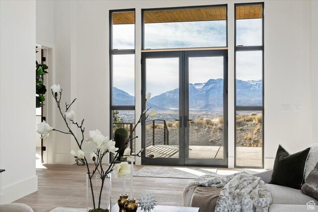 1316 N Gold Mountain Cir, Heber City, UT 84032 - living room featuring a wall of windows, wood finished floors, and a mountain view