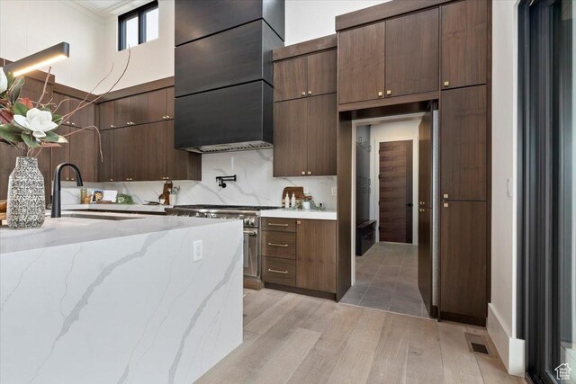 1316 N Gold Mountain Cir, Heber City, UT 84032 - kitchen featuring light wood-type flooring, stainless steel stove, a sink, modern cabinets, and open shelves
