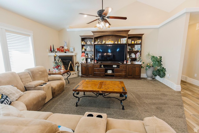 743 N 1100 E, Nephi, UT 84648 - living room with vaulted ceiling, visible vents, wood finished floors, a glass covered fireplace, and ceiling fan