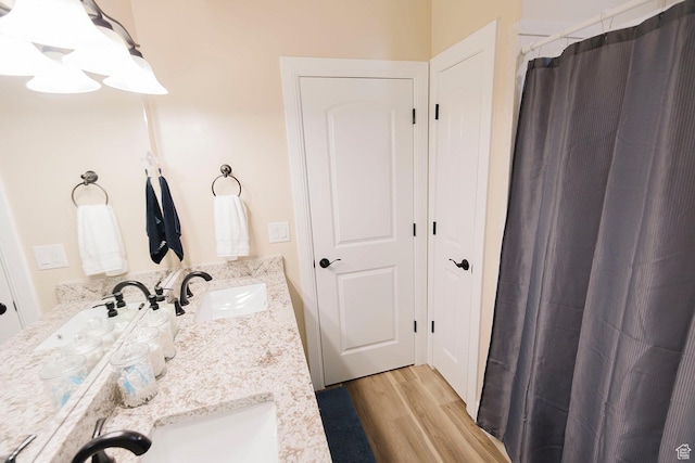 743 N 1100 E, Nephi, UT 84648 - full bathroom with a shower with curtain, wood finished floors, a sink, and double vanity