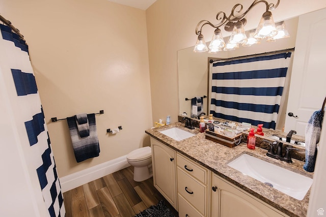 743 N 1100 E, Nephi, UT 84648 - bathroom with baseboards, wood finished floors, a sink, and toilet