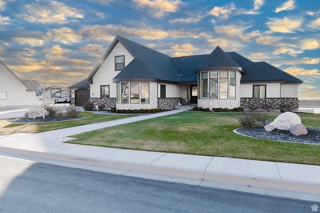 743 N 1100 E, Nephi, UT 84648 - french country style house featuring roof with shingles, stone siding, and a front lawn