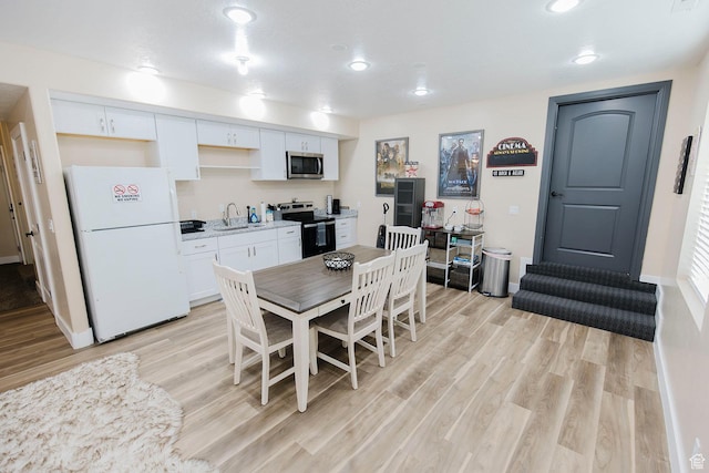 743 N 1100 E, Nephi, UT 84648 - dining room featuring light wood-style flooring, baseboards, and recessed lighting