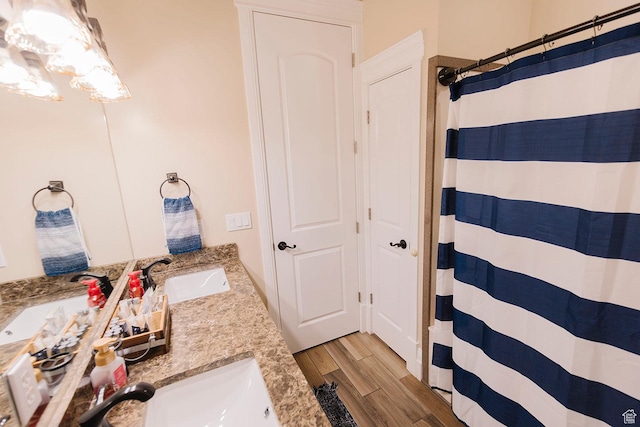 743 N 1100 E, Nephi, UT 84648 - bathroom with a shower with curtain, wood finished floors, a sink, and double vanity