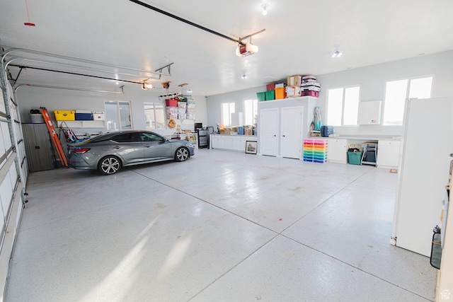 743 N 1100 E, Nephi, UT 84648 - garage featuring freestanding refrigerator and a garage door opener
