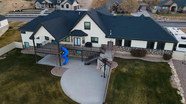 743 N 1100 E, Nephi, UT 84648 - back of house featuring stucco siding, a residential view, a deck, and a fenced backyard
