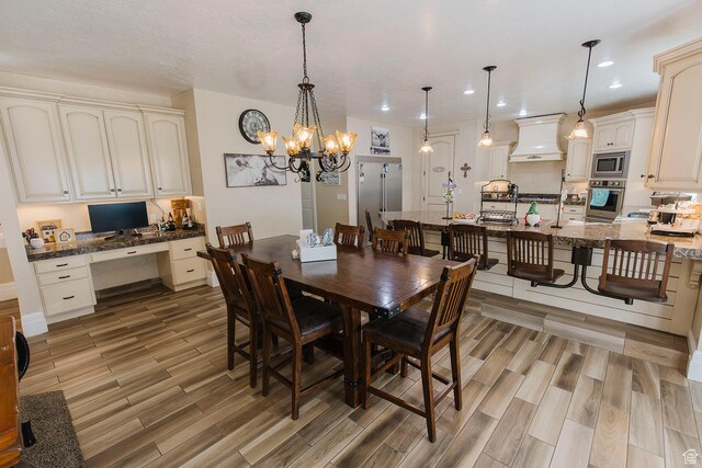 743 N 1100 E, Nephi, UT 84648 - dining space featuring built in study area, an inviting chandelier, light wood finished floors, and recessed lighting
