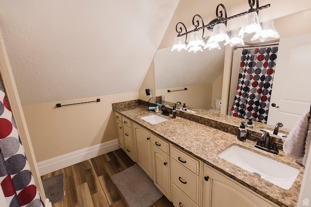 743 N 1100 E, Nephi, UT 84648 - bathroom featuring baseboards, lofted ceiling, and a sink