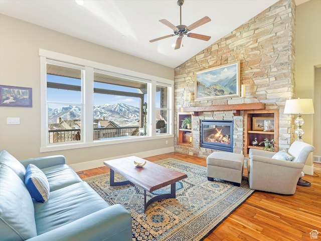 1628 E Viewside Cir, Hideout, UT 84036 - living room featuring a mountain view, lofted ceiling, ceiling fan, a fireplace, and wood-type flooring