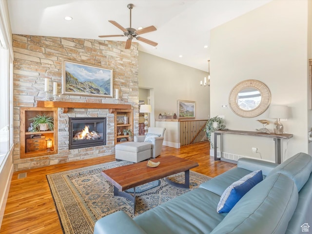1628 E Viewside Cir, Hideout, UT 84036 - living room featuring ceiling fan with notable chandelier, light wood-type flooring, a fireplace, and high vaulted ceiling