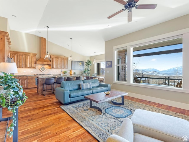 1628 E Viewside Cir, Hideout, UT 84036 - living room with a mountain view, light wood-type flooring, vaulted ceiling, and ceiling fan