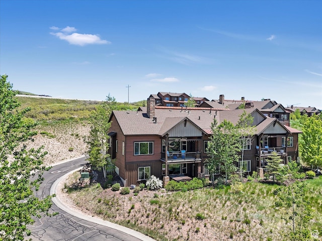 1628 E Viewside Cir, Hideout, UT 84036 - rear view of house with a balcony and a shingled roof