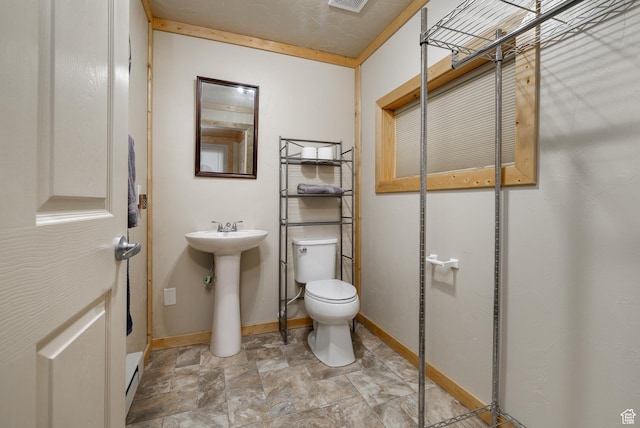 2690 W 500 N, Vernal, UT 84078 - bathroom featuring toilet, crown molding, and sink