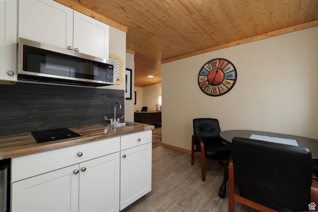 2690 W 500 N, Vernal, UT 84078 - kitchen with sink, wooden ceiling, wooden counters, light hardwood / wood-style floors, and white cabinets