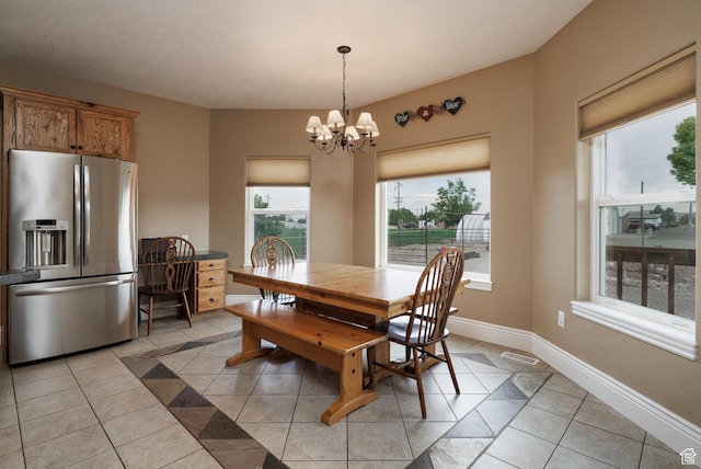 2690 W 500 N, Vernal, UT 84078 - dining room with light tile patterned floors, an inviting chandelier, and a healthy amount of sunlight