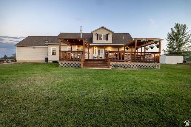 2690 W 500 N, Vernal, UT 84078 - back house at dusk featuring a pergola, a deck, a storage shed, and a lawn