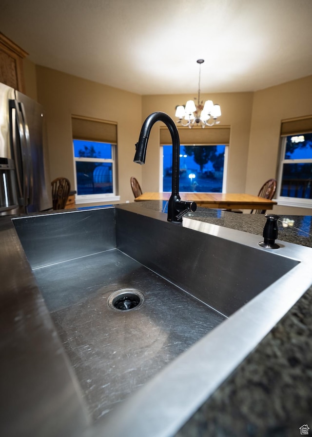 2690 W 500 N, Vernal, UT 84078 - room details featuring pendant lighting, stainless steel fridge, sink, and a chandelier