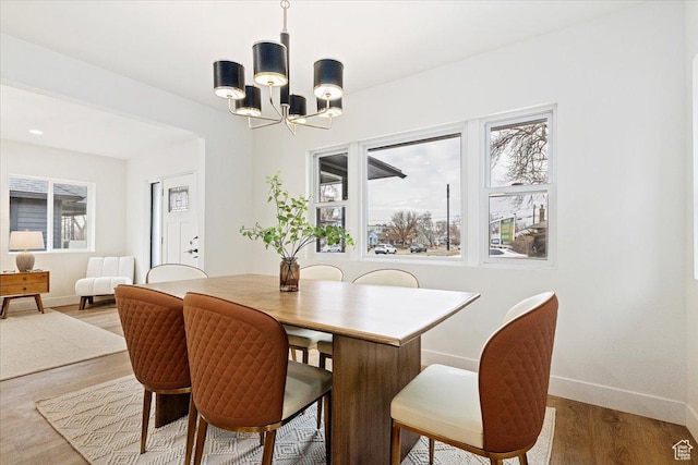 246 E 2100 S, South Salt Lake, UT 84115 - dining space featuring a chandelier and light wood-style floors