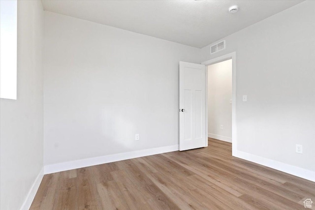 246 E 2100 S, South Salt Lake, UT 84115 - empty room with wood finished floors and a smoke detector