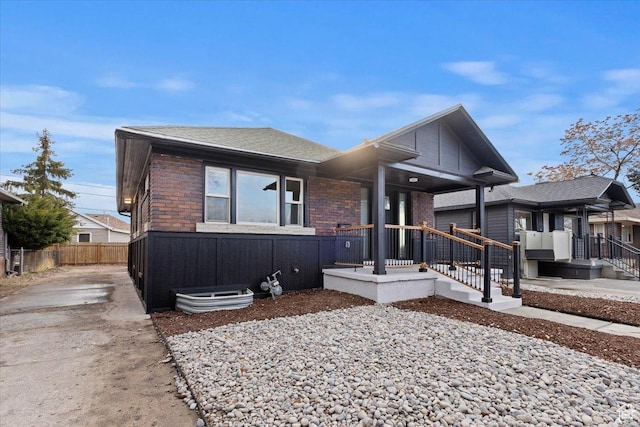 246 E 2100 S, South Salt Lake, UT 84115 - view of front of property featuring brick siding, roof with shingles, and driveway