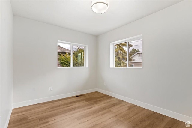 246 E 2100 S, South Salt Lake, UT 84115 - unfurnished room with plenty of natural light and light wood finished floors