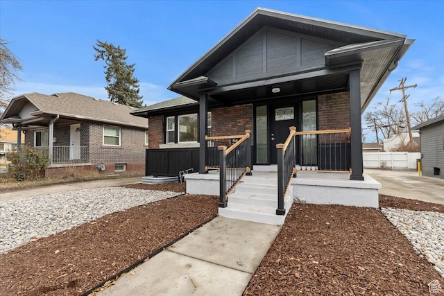 246 E 2100 S, South Salt Lake, UT 84115 - view of front of house featuring brick siding and covered porch