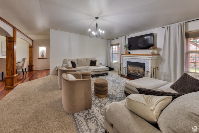 558 Winesap Cir, Moab, UT 84532 - living area featuring a chandelier, a fireplace, healthy amount of natural light, and wood finished floors
