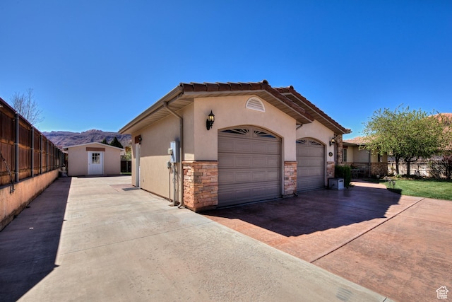 558 Winesap Cir, Moab, UT 84532 - view of front of house featuring a mountain view and a storage shed