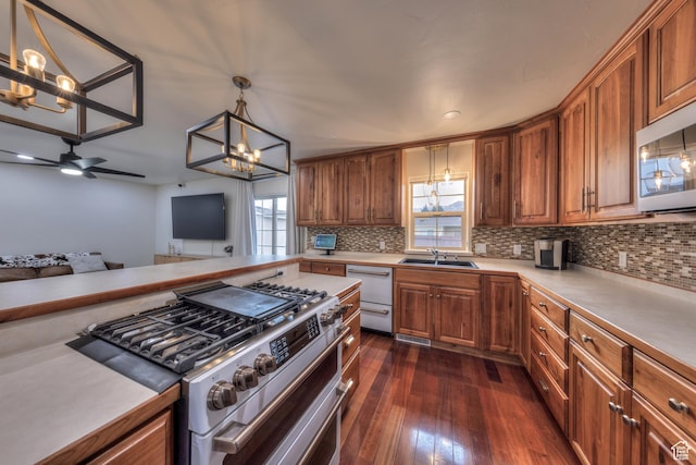 558 Winesap Cir, Moab, UT 84532 - kitchen featuring dark hardwood / wood-style floors, double oven range, hanging light fixtures, and plenty of natural light