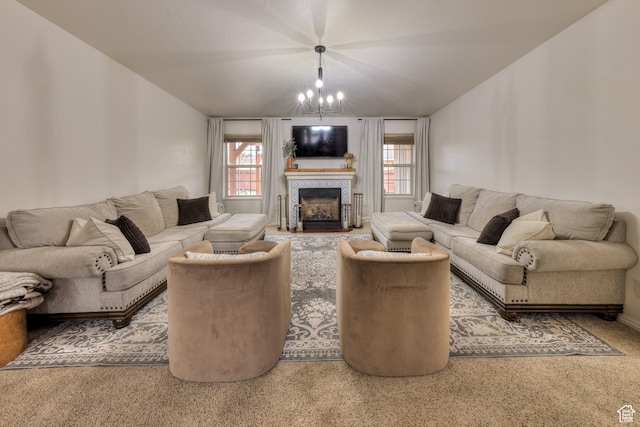 558 Winesap Cir, Moab, UT 84532 - living room featuring a chandelier, a tiled fireplace, and carpet floors