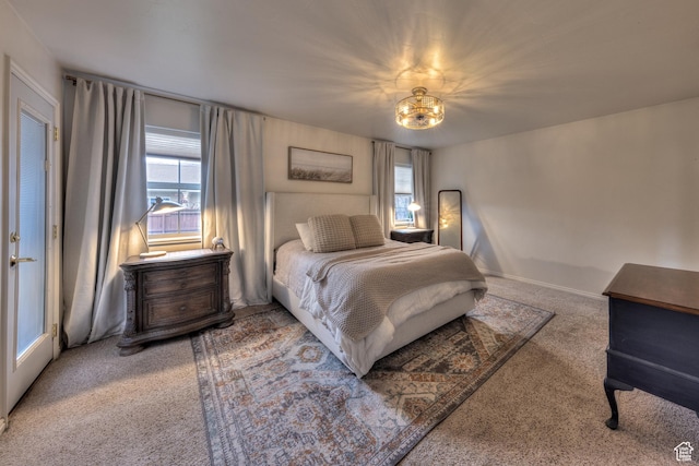 558 Winesap Cir, Moab, UT 84532 - bedroom with carpet floors and a chandelier