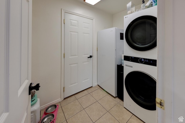 558 Winesap Cir, Moab, UT 84532 - laundry area with stacked washer / dryer and light tile patterned floors