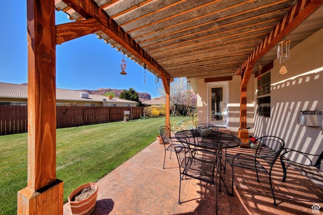 558 Winesap Cir, Moab, UT 84532 - fenced backyard featuring a patio area and outdoor dining area