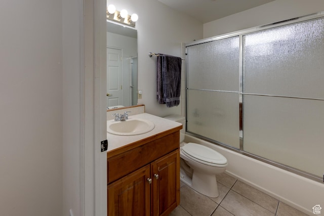 558 Winesap Cir, Moab, UT 84532 - full bathroom featuring tile patterned floors, vanity, bath / shower combo with glass door, and toilet