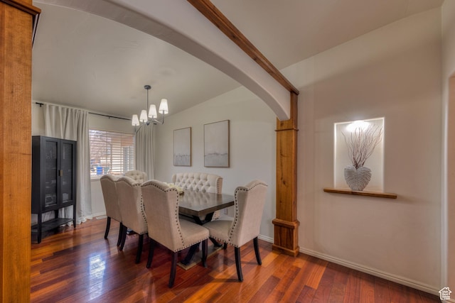 558 Winesap Cir, Moab, UT 84532 - dining area featuring dark hardwood / wood-style flooring, vaulted ceiling, and a notable chandelier