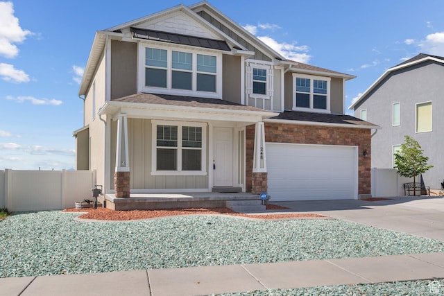 248 W Quartz Rd, Tooele, UT 84074 - craftsman-style house featuring board and batten siding, a porch, concrete driveway, an attached garage, and stone siding