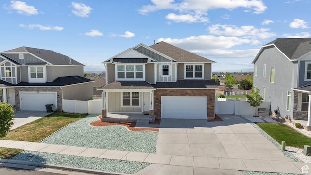 248 W Quartz Rd, Tooele, UT 84074 - view of front of house with board and batten siding, concrete driveway, a garage, and stone siding
