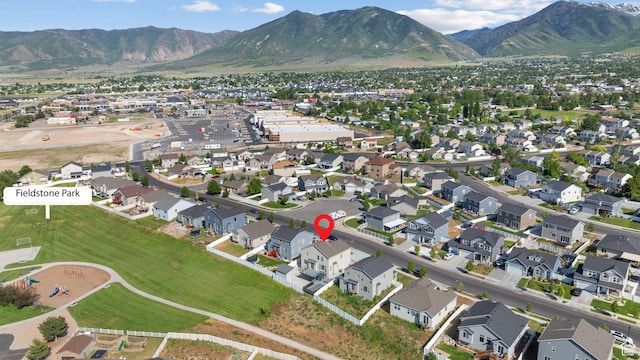 248 W Quartz Rd, Tooele, UT 84074 - aerial overview of property's location with a mountainous background and nearby suburban area
