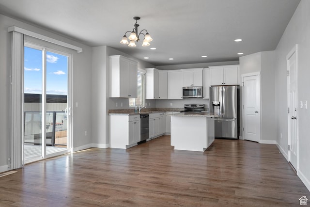 248 W Quartz Rd, Tooele, UT 84074 - kitchen featuring stainless steel appliances, a chandelier, white cabinets, dark wood finished floors, and recessed lighting