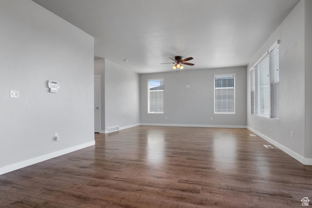 248 W Quartz Rd, Tooele, UT 84074 - unfurnished room with a ceiling fan, baseboards, and dark wood-style flooring