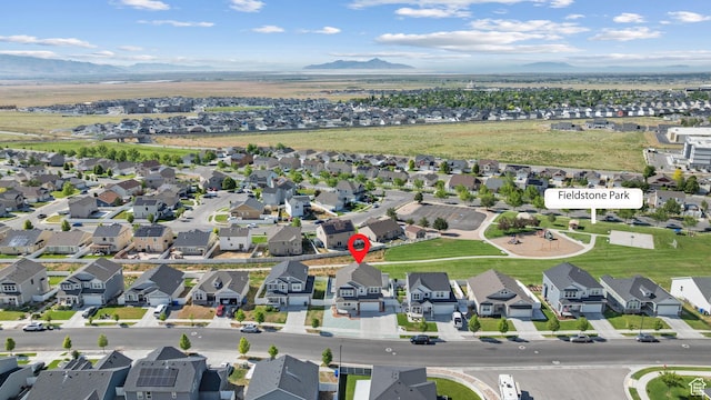 248 W Quartz Rd, Tooele, UT 84074 - aerial perspective of suburban area featuring a mountainous background