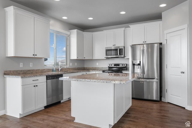 248 W Quartz Rd, Tooele, UT 84074 - kitchen featuring stainless steel appliances, white cabinets, dark wood-style floors, recessed lighting, and a sink
