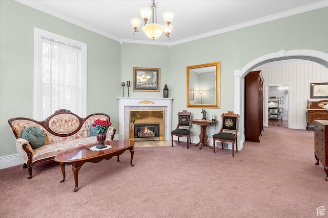 living area featuring a notable chandelier, light colored carpet, and crown molding