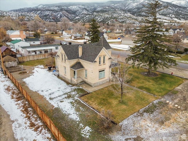 snowy aerial view featuring a mountain view