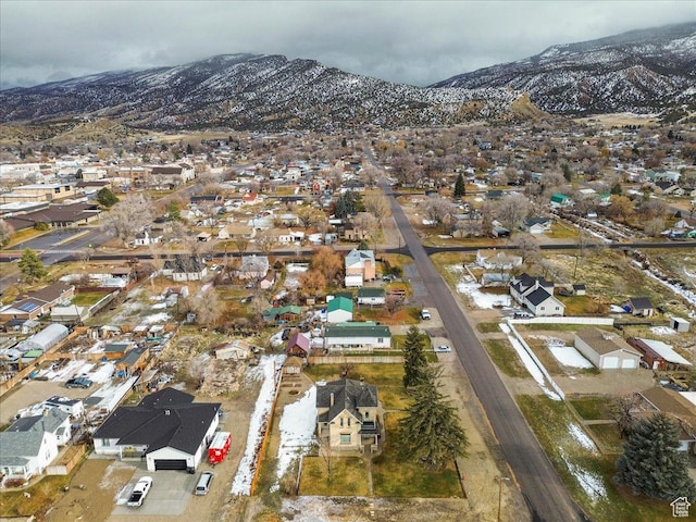 birds eye view of property featuring a mountain view
